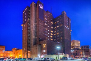 A multi-story hotel with a prominent 'DoubleTree' sign, featuring a classic architectural design with brickwork and multiple windows.