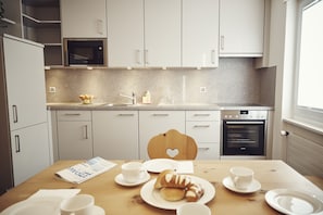 Comfort Apartment, 1 Bedroom | Private kitchen | Full-sized fridge, stovetop, coffee/tea maker, electric kettle