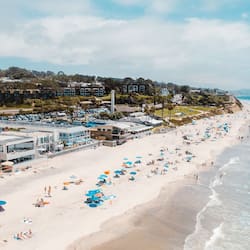 On the beach, surfing