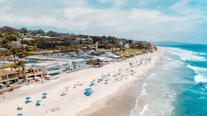 On the beach, surfing