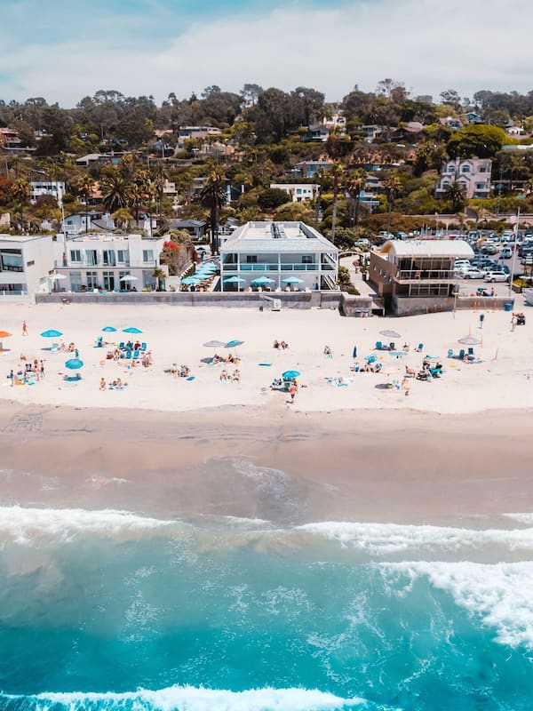 On the beach, surfing