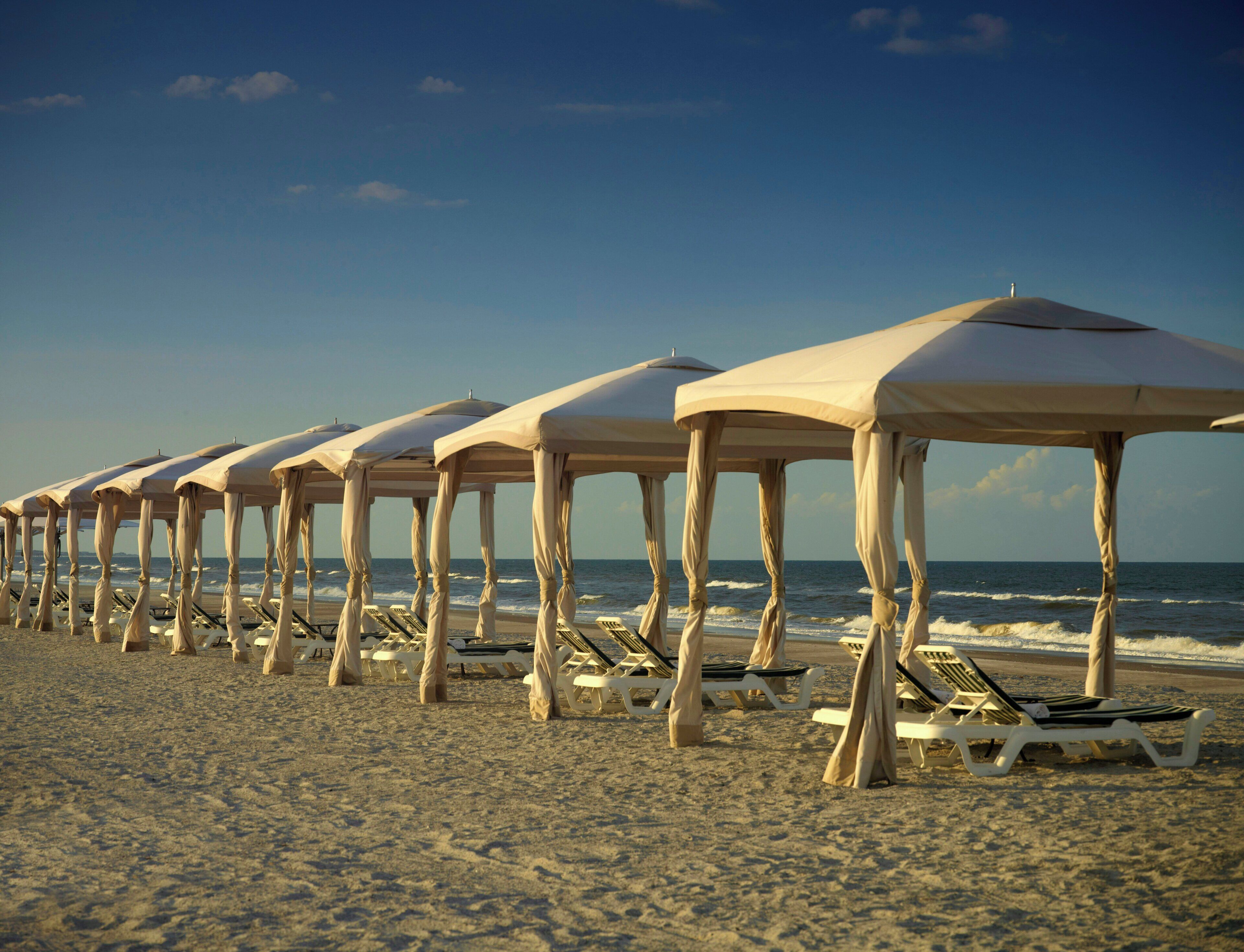 On the beach, beach cabanas, beach towels, kayaking