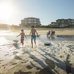 On the beach, beach cabanas, beach towels, beach volleyball