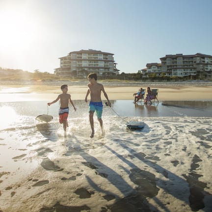 On the beach, beach cabanas, beach towels, beach volleyball