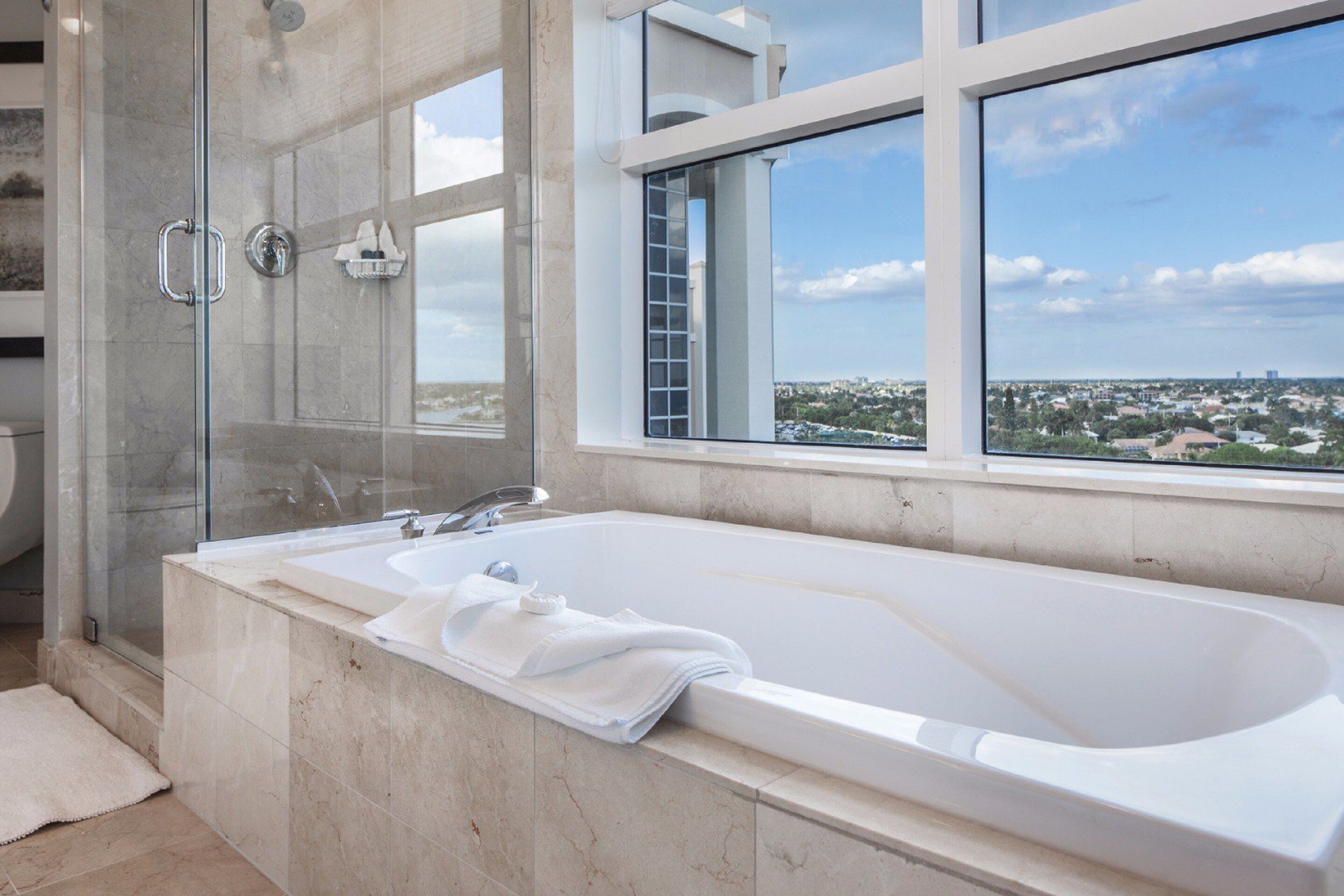 designer toiletries, hair dryer, bathrobes, slippers