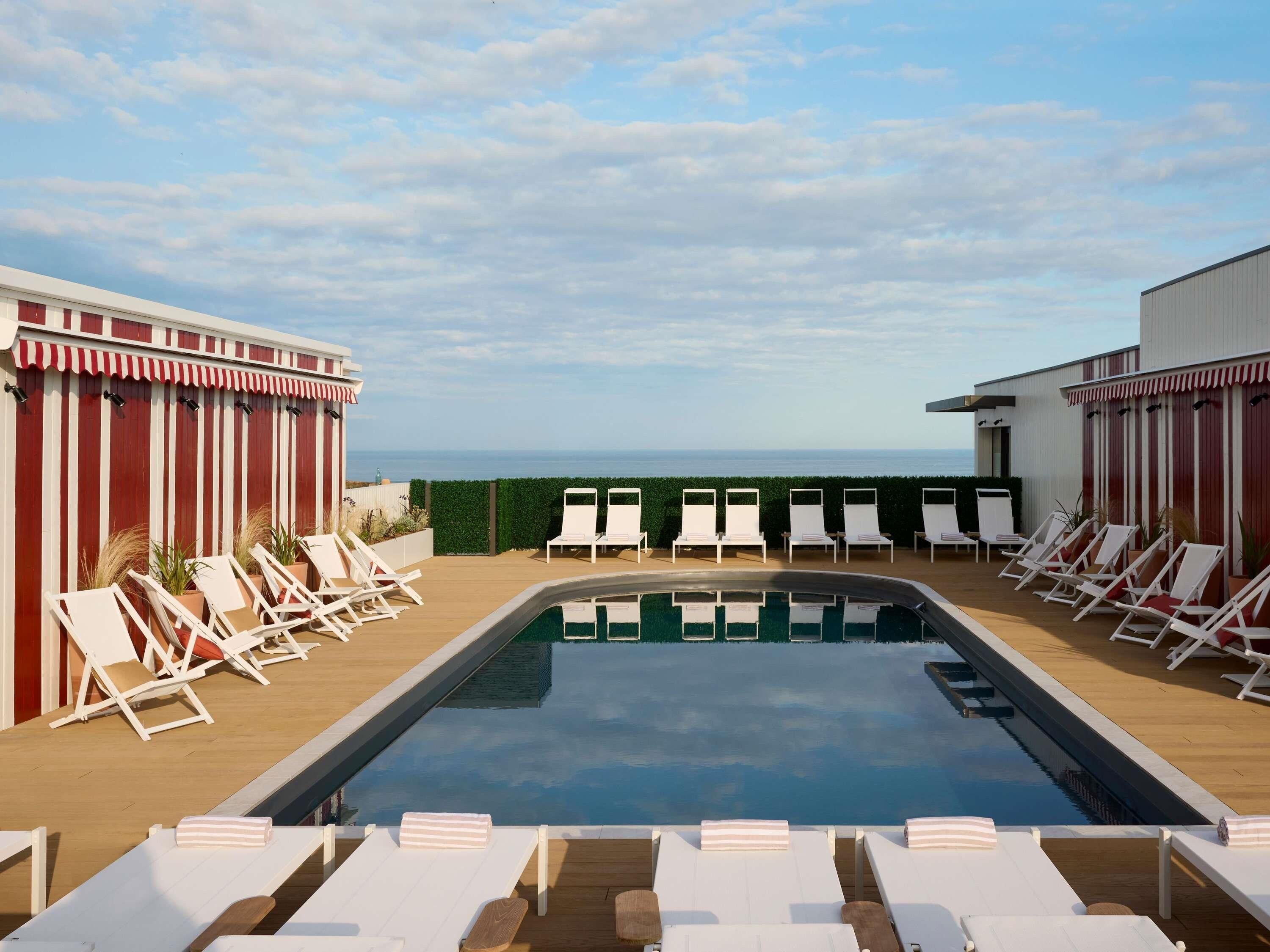 Seasonal outdoor pool, open 8:00 AM to 10:00 PM, pool loungers
