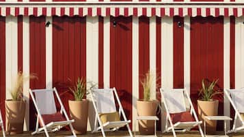 Seasonal outdoor pool, open 8:00 AM to 10:00 PM, sun loungers