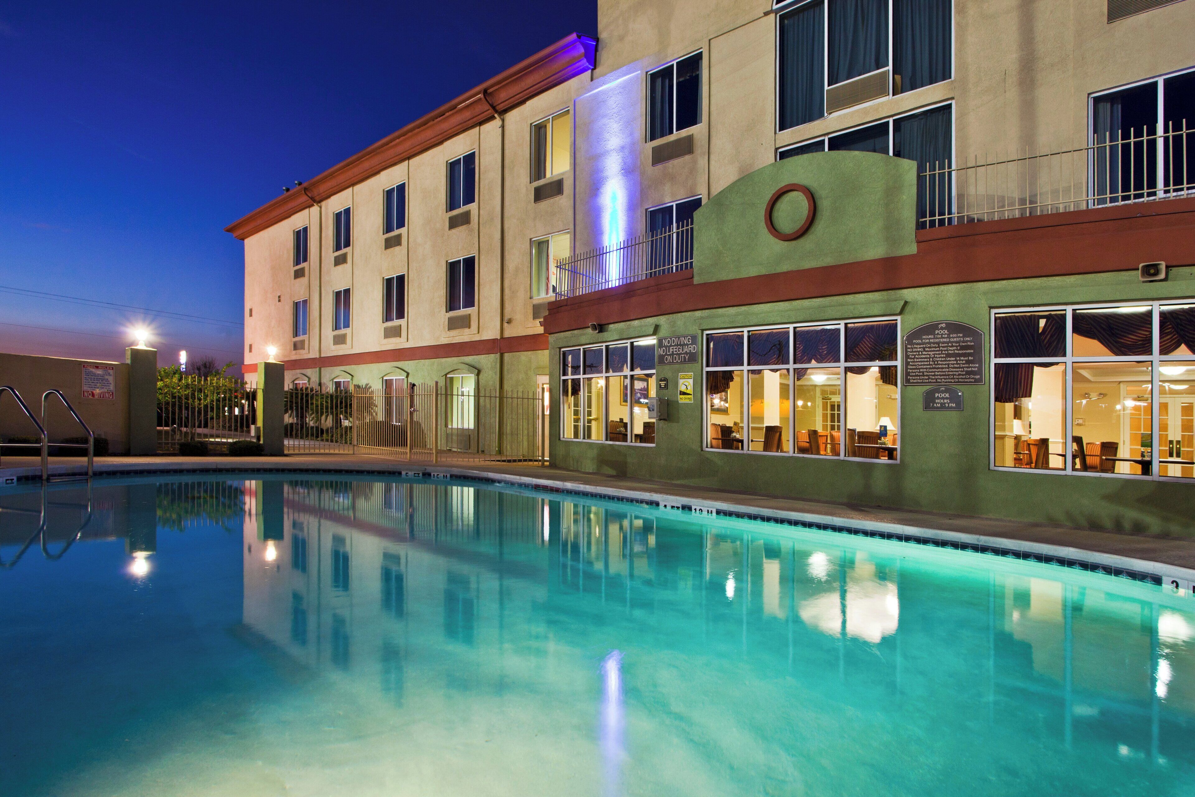 Outdoor pool, open 7:00 AM to 10:00 PM, pool umbrellas, pool loungers