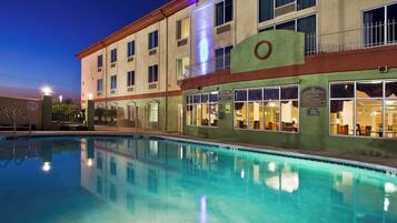 Outdoor pool, open 7:00 AM to 10:00 PM, pool umbrellas, pool loungers