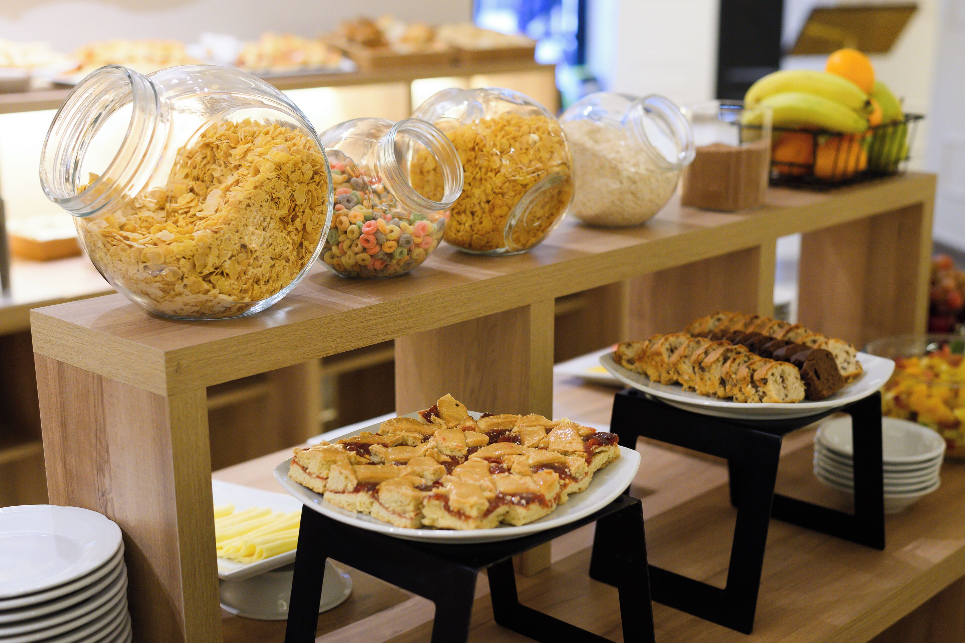 A buffet with various food items and containers.