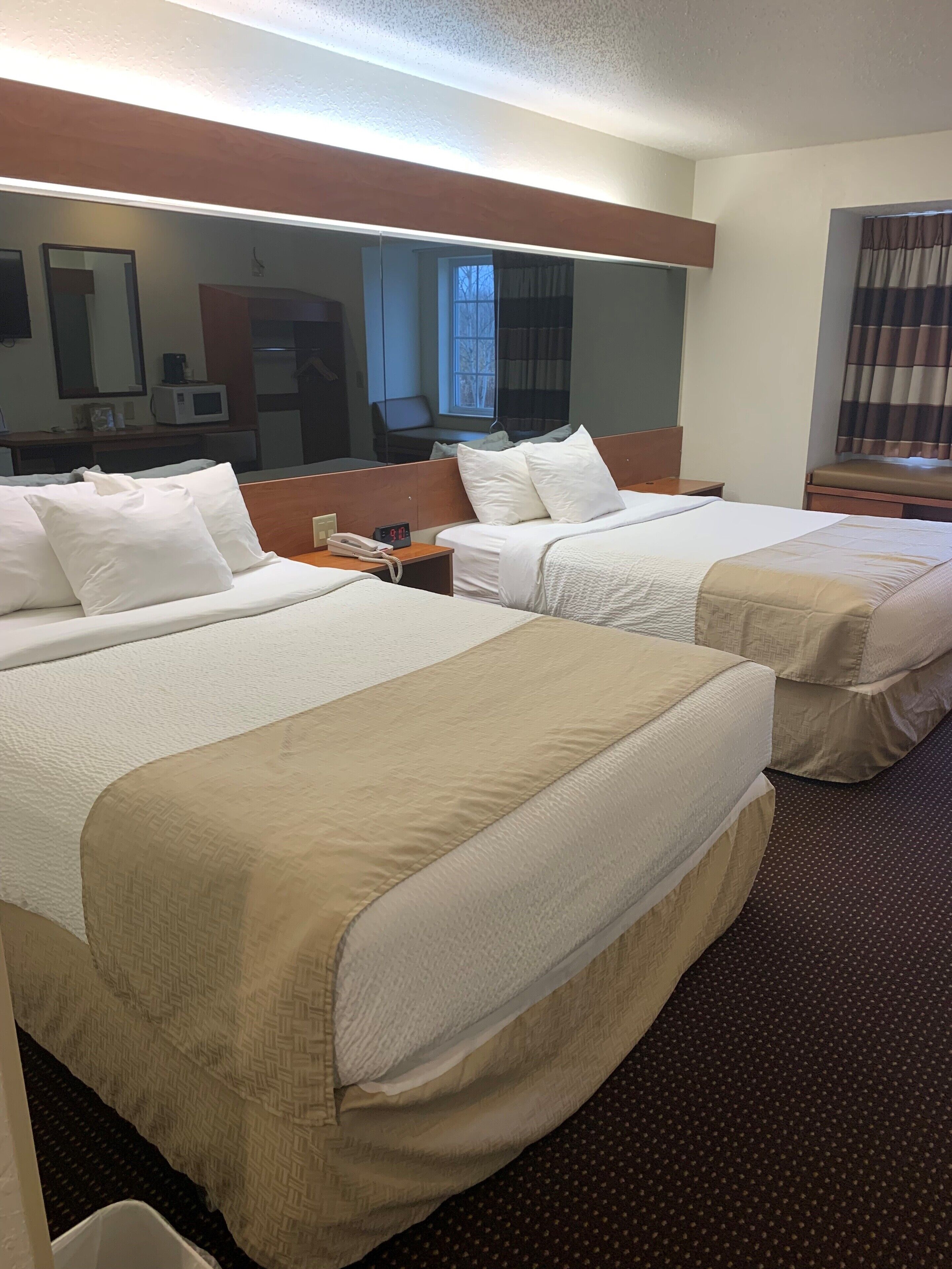 hypo-allergenic bedding, down duvets, desk, blackout curtains