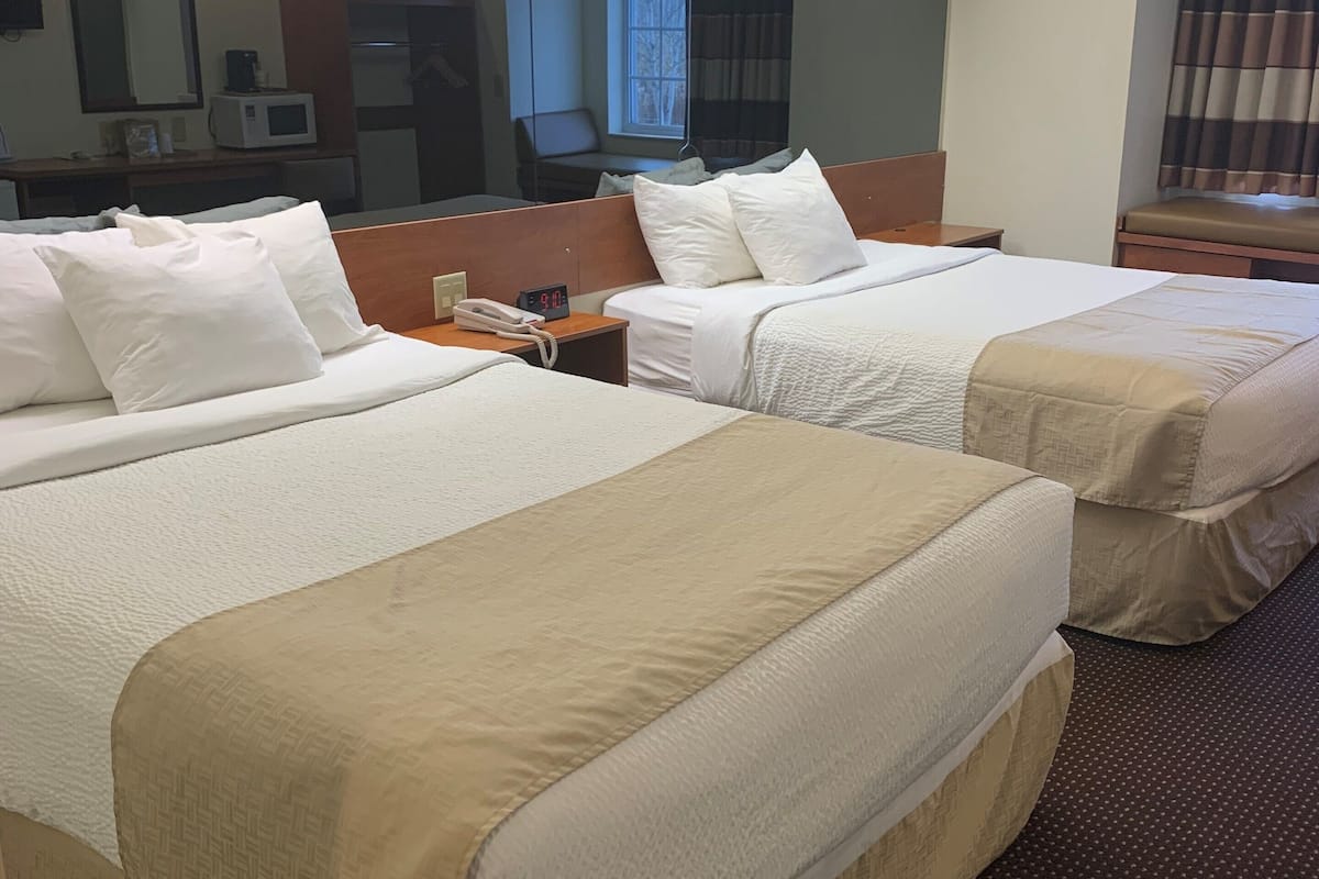 hypo-allergenic bedding, down duvets, desk, blackout curtains