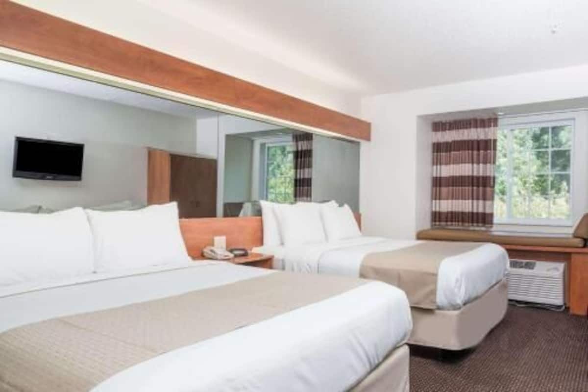 Down comforters, desk, blackout drapes, iron/ironing board