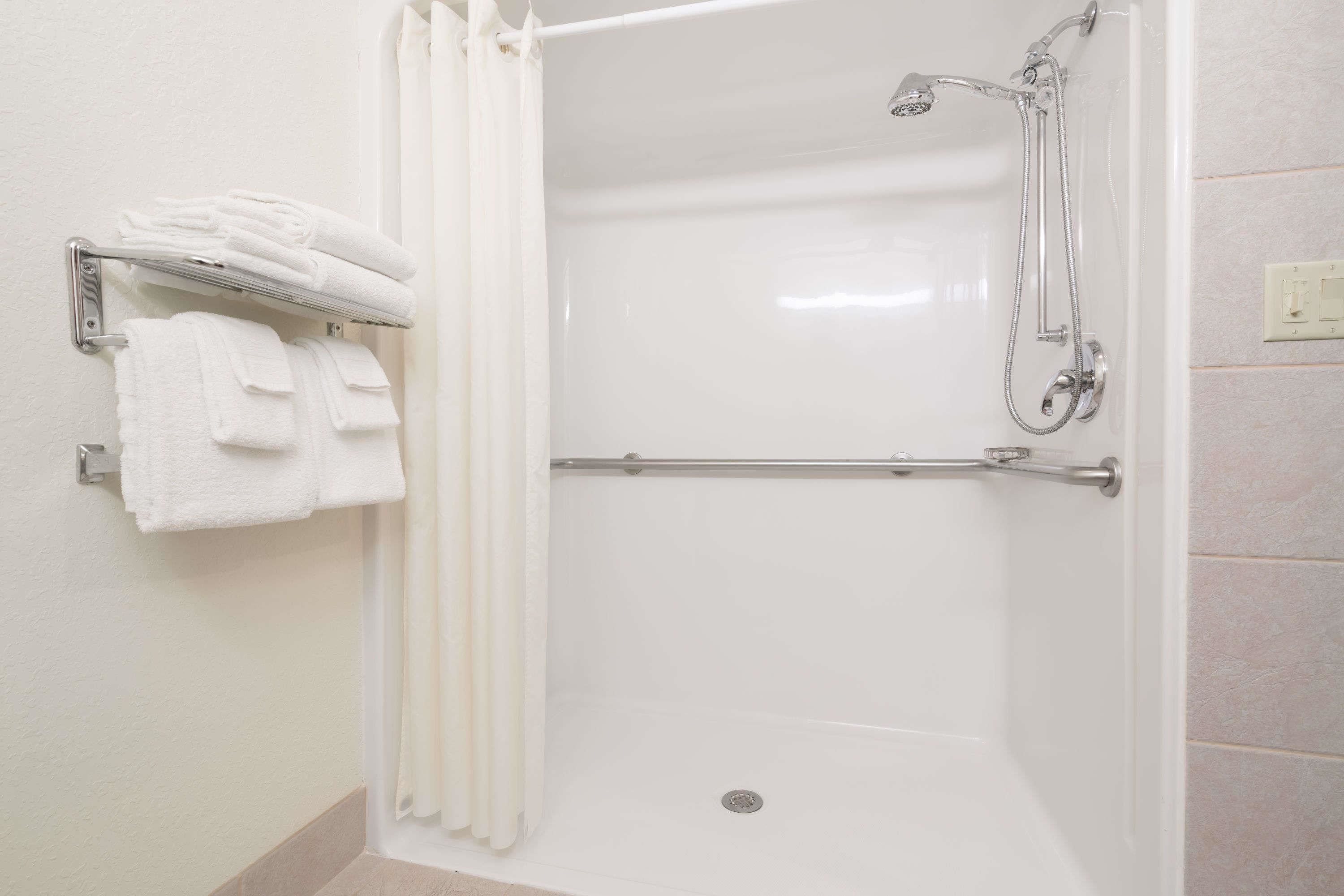 room, 2 queen beds, roll-in shower, non smoking | bathroom | combined shower/bathtub, free toiletries, hair dryer, towels