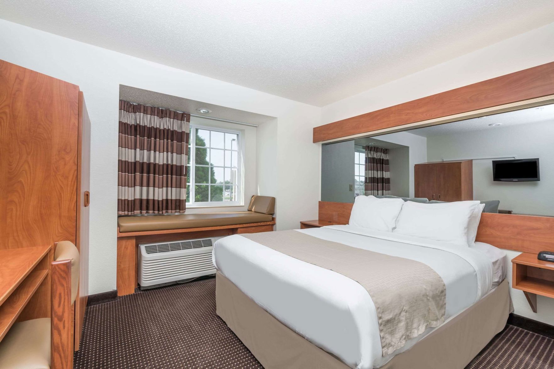 Down comforters, desk, blackout drapes, iron/ironing board