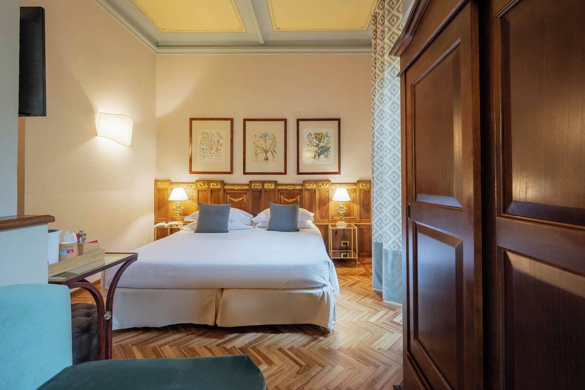 Classic Quadruple Room | Hypo-allergenic bedding available, minibar, in-room safe, desk
