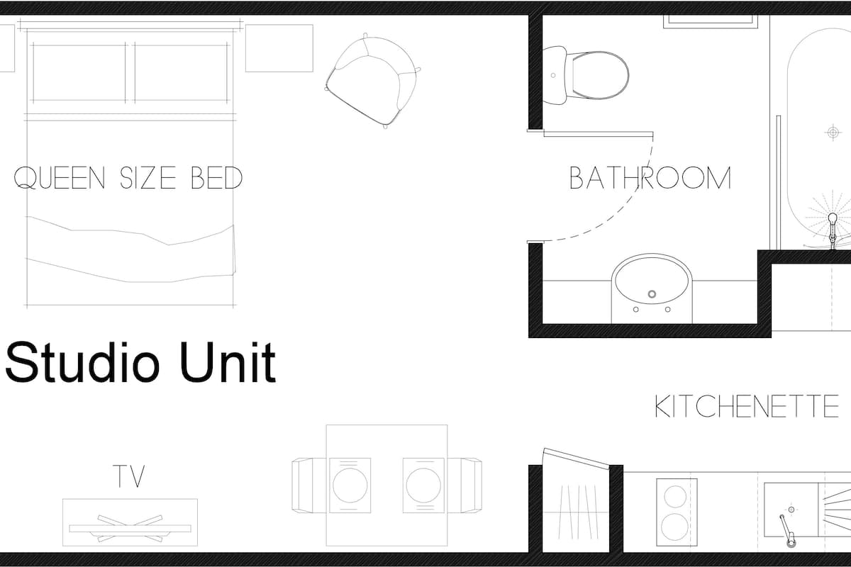 Distribución de un estudio con cama tamaño queen, televisor, kitchenette y baño.