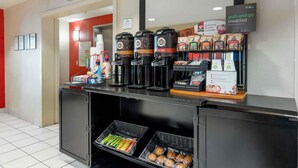 A grab-and-go breakfast station with coffee machines, hot water dispensers, and packaged food items. - Extended Stay America Suites Fremont Warm Springs (Fremont)
