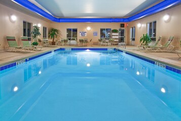 Indoor pool, open 9:00 AM to 9:00 PM, pool loungers