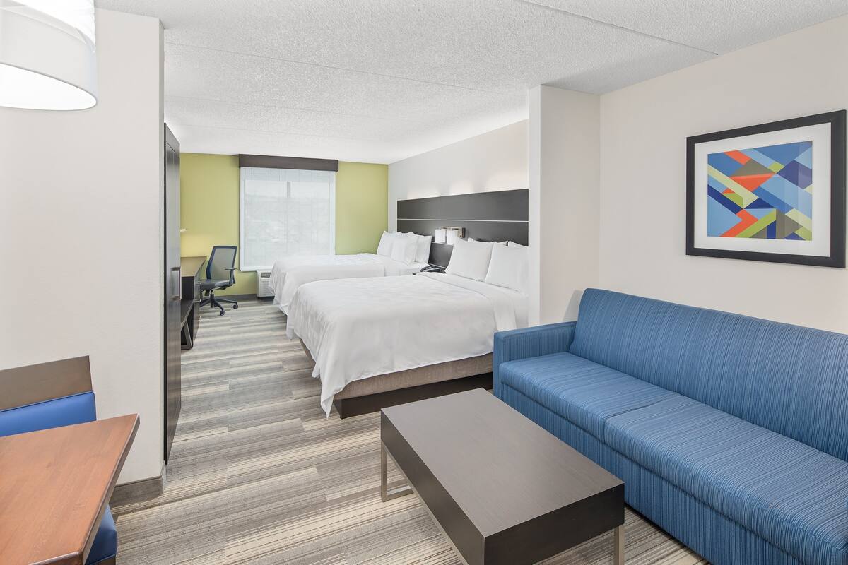 suite, 2 queen beds | in-room safe, desk, iron/ironing board, free cots/infant beds