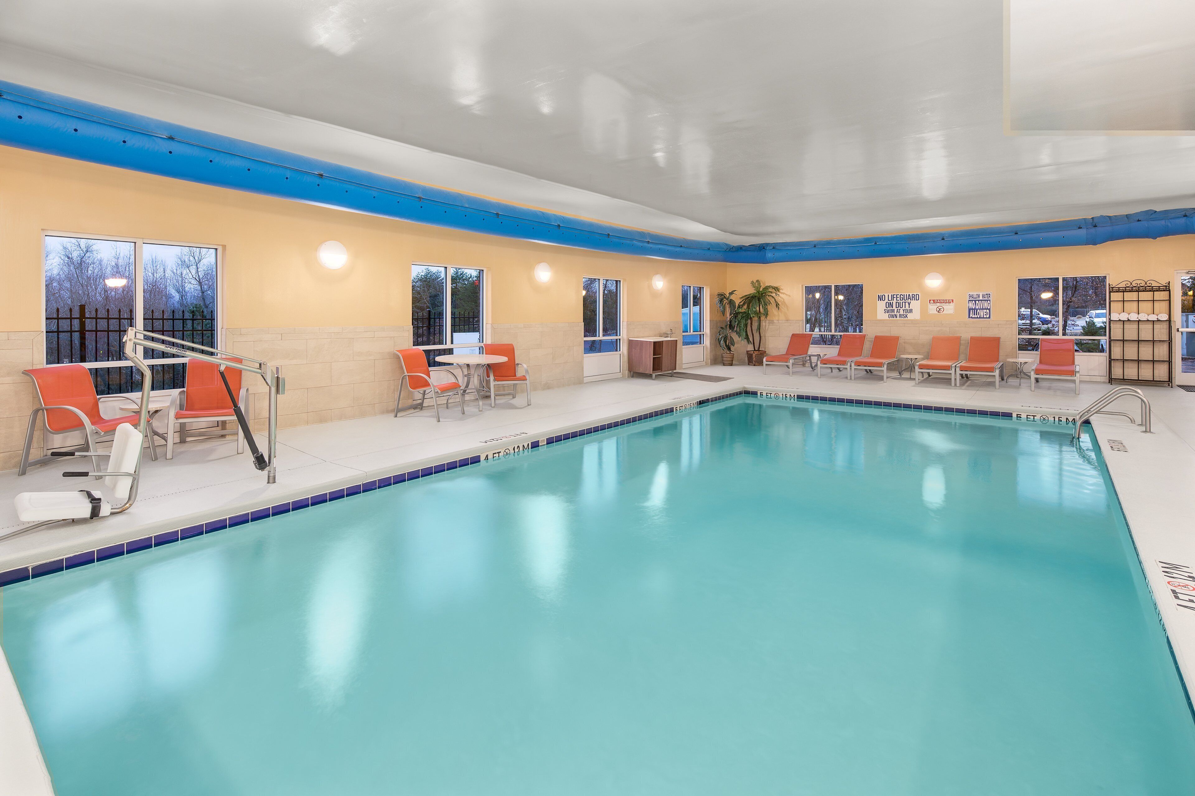 indoor pool, open 9:00 am to 9:00 pm, pool loungers