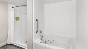 A modern bathroom with a walk-in shower, a bathtub, and a toilet. - Holiday Inn Express & Suites Greenville-I-85 & Woodruff Rd by IHG (Greenville)