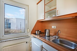 Fridge, stovetop, cookware/dishes/utensils