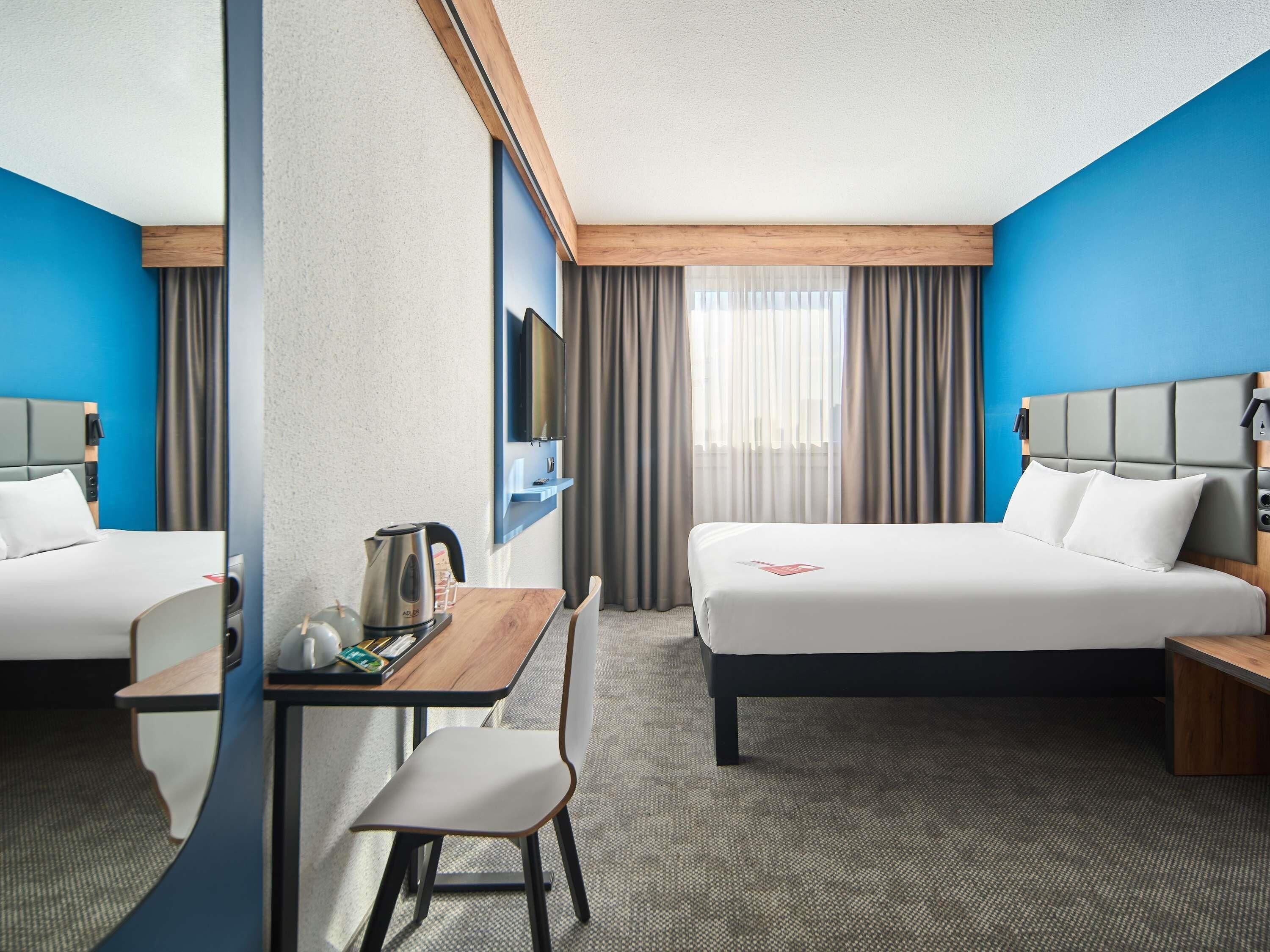 Deluxe kamer, 1 tweepersoonsbed | Luxe beddengoed, een kluis op de kamer, een bureau, een laptopwerkplek