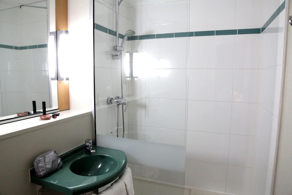 shower, eco-friendly toiletries, hair dryer, towels