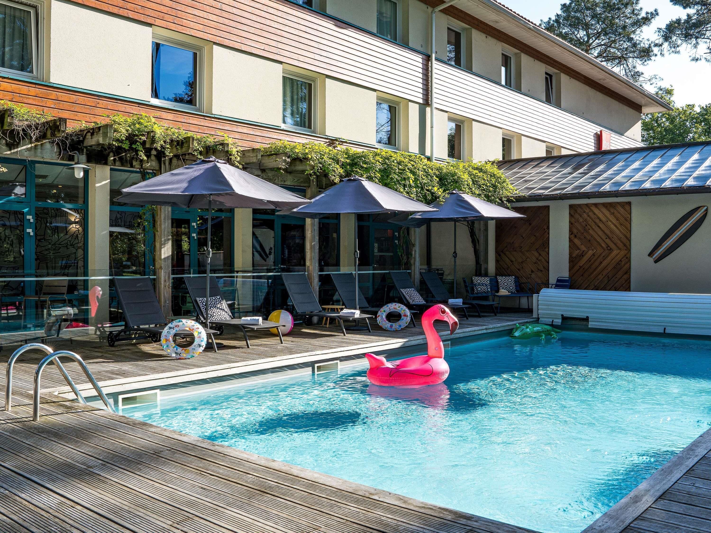 seasonal outdoor pool, pool umbrellas, pool loungers