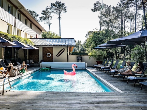 Seasonal outdoor pool, pool umbrellas, pool loungers