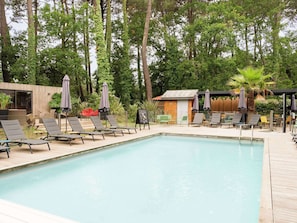 Seasonal outdoor pool, pool umbrellas, pool loungers