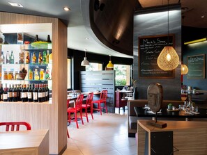 Breakfast, lunch, dinner served; international cuisine, pool views 