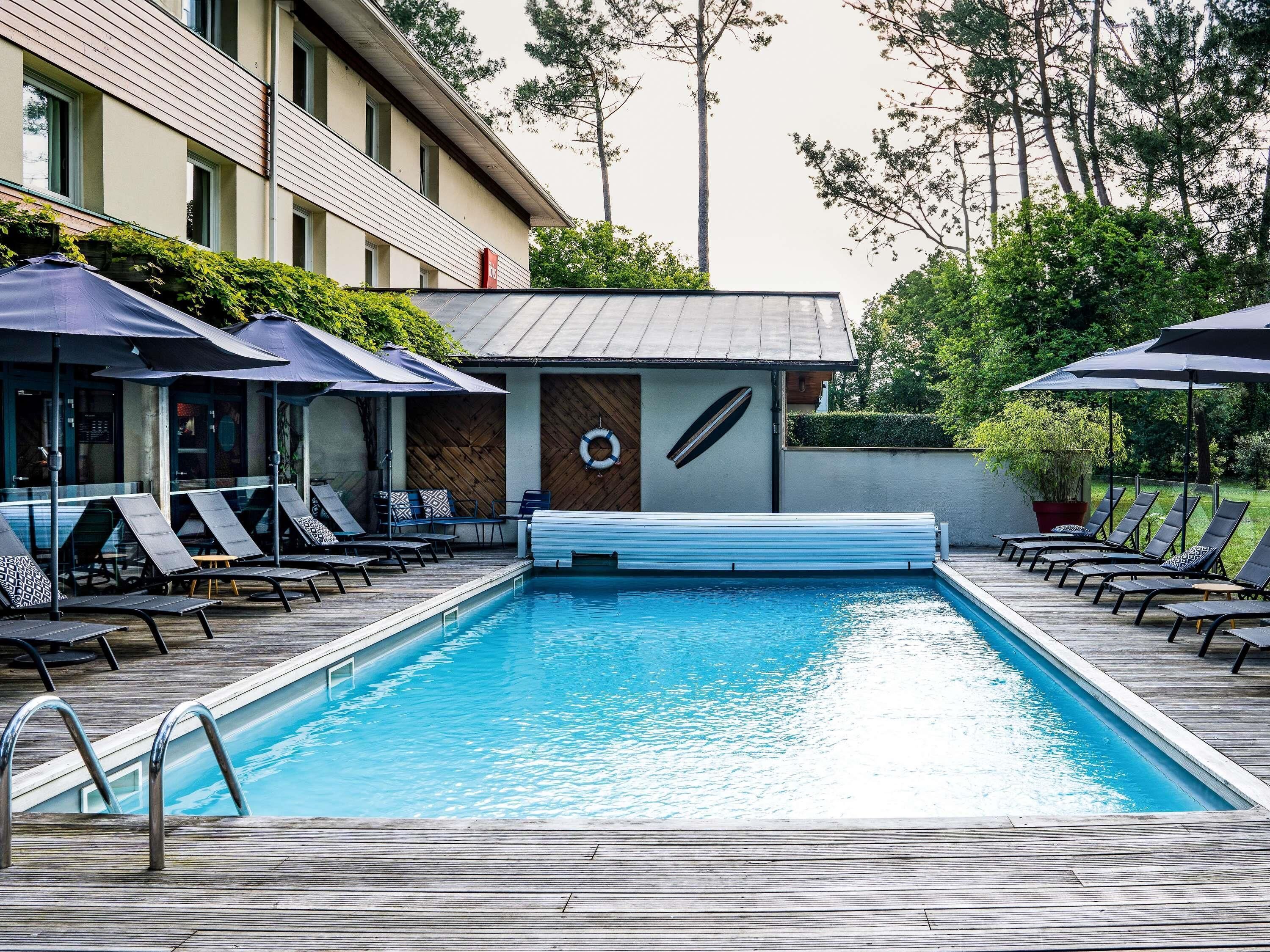 seasonal outdoor pool, pool umbrellas, pool loungers