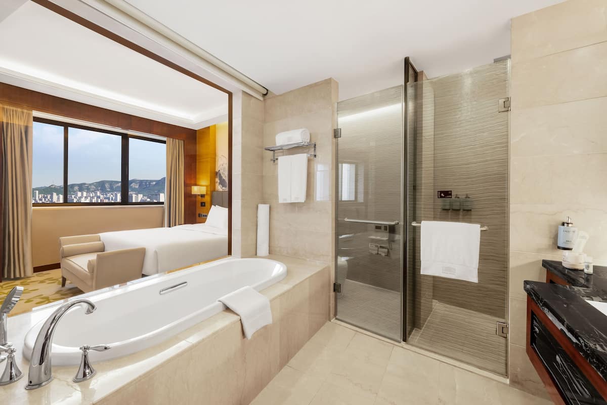 luxury family room | bathroom | shower, designer toiletries, hair dryer, bathrobes