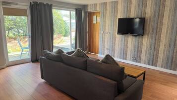 Superior Suite, 1 Double Bed | Living area | 22-inch TV with digital channels