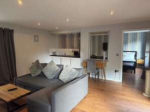 Superior Suite, 1 Double Bed | Living area | 22-inch TV with digital channels