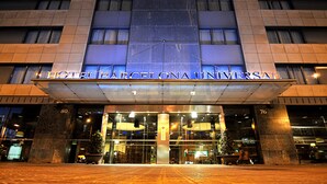 The exterior of Hotel Barcelona Universal with a modern facade, large glass windows, and a prominent entrance. - Hotel Barcelona Universal (Barcelona)