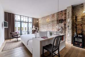 Premium bedding, desk, laptop workspace, soundproofing