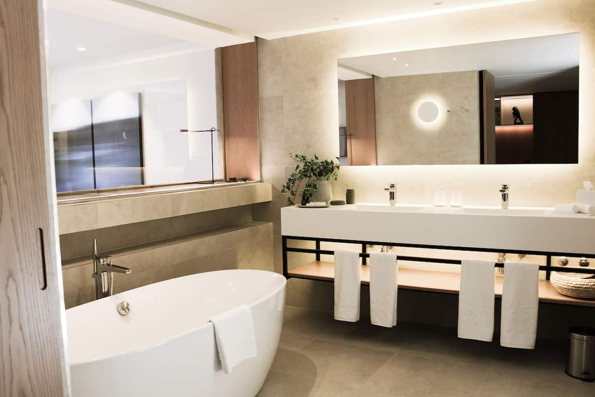 signature suite, balcony | bathroom | shower, rainfall showerhead, hair dryer, bathrobes