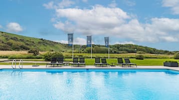 Seasonal outdoor pool, pool umbrellas, pool loungers