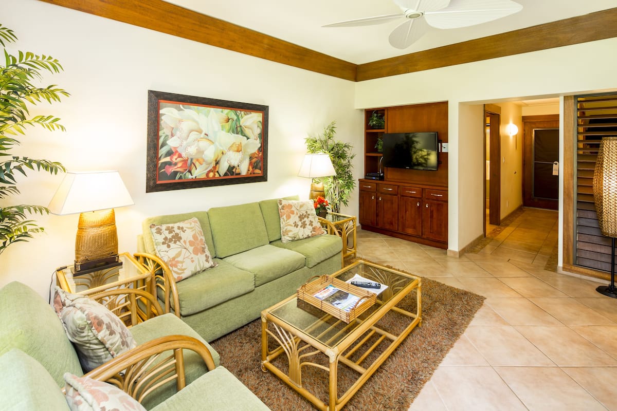 Suite, 1 Bedroom, Garden View | In-room safe, desk, laptop workspace, iron/ironing board