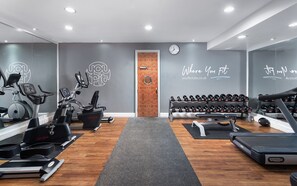 A gym with cardio machines, dumbbells, and a treadmill. - voco St. John's Solihull by IHG (Solihull)