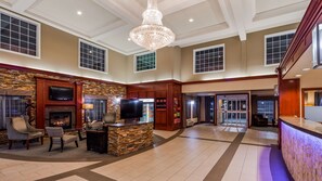 Experience the elegant lobby with a high ceiling, comfortable seating area, fireplace, and a well-stocked minibar.