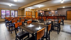 Enjoy meals in a spacious dining area with comfortable seating and well-lit tables.