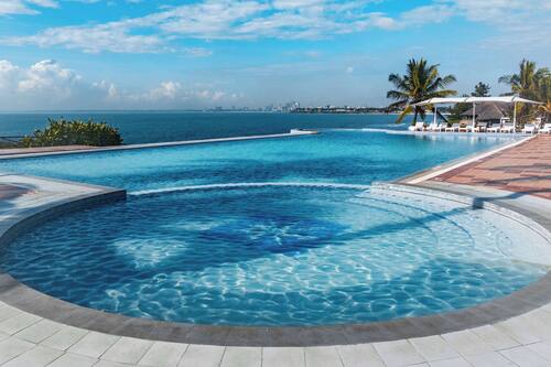 Outdoor pool, pool umbrellas, sun loungers
