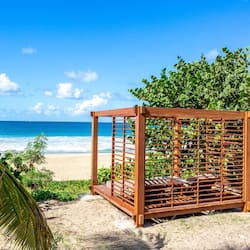 On the beach, white sand, sun-loungers, beach towels