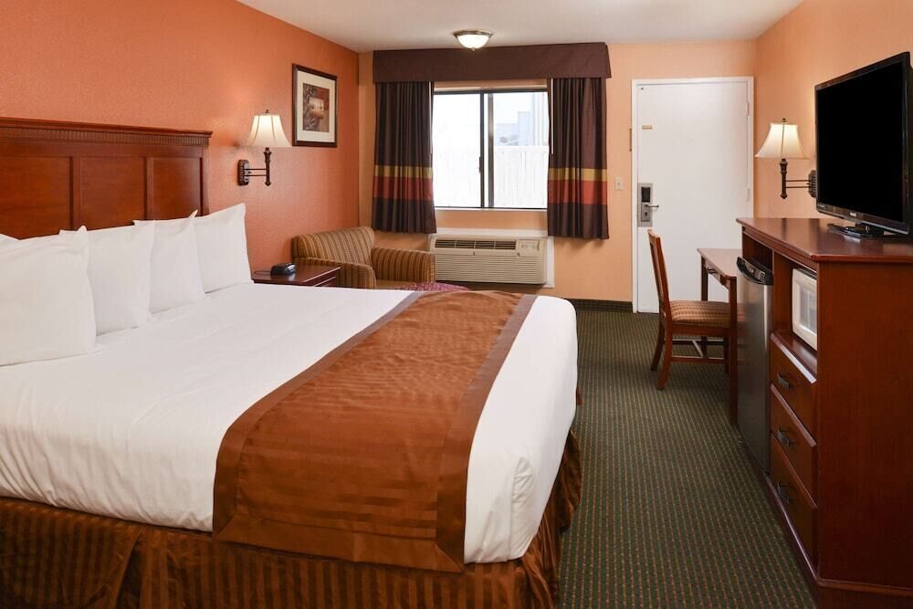 Desk, blackout drapes, iron/ironing board, rollaway beds