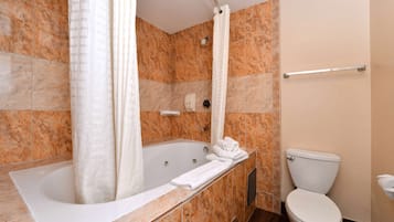 Suite, 1 King Bed, Non Smoking, Jetted Tub | Desk, blackout drapes, iron/ironing board, rollaway beds