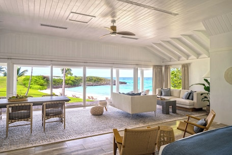 55-inch Smart TV with cable channels, TV, books. The Cove Eleuthera